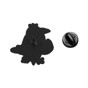 Macro detail of the metal pin back and black rubber clutch closure for bird brooch