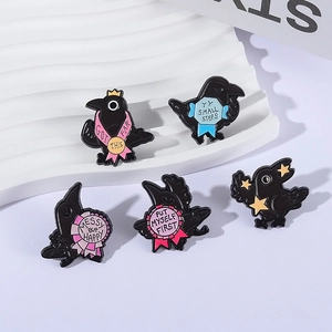 5-piece creative black enamel crow brooch set with motivational quotes on white stand