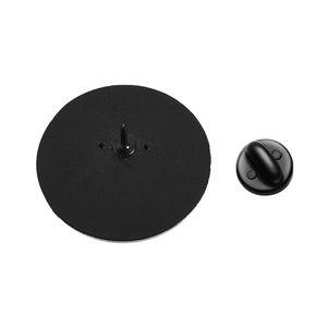 Close-up of black metal pin backing and soft rubber clutch closure for creative brooches