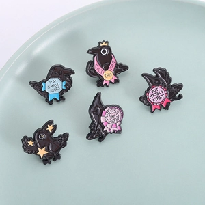 Five-piece black enamel crow brooch set with motivational quotes and gold star accents