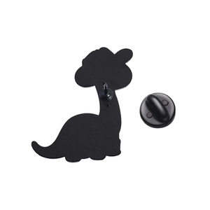 Detail view of the black matte back of a dinosaur enamel pin with a single pin and rubber clutch