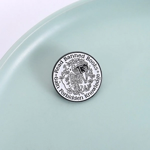 Gothic skull reading books enamel pin with Read Banned Books text on round badge