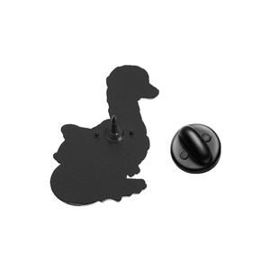 Macro view of the matte black enamel duck brooch back with secure rubber clutch