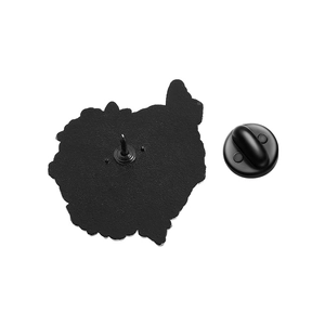 Detail of gothic black metal brooch back with secure rubber clutch fastener on white base