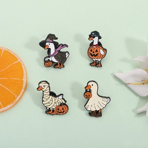 Set of four Halloween duck enamel pins featuring wizard, pumpkin, mummy and ghost themes