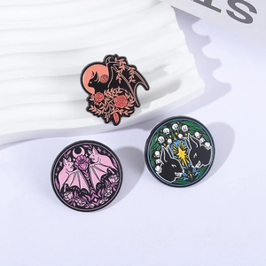 Gothic bat and moon enamel pin set featuring flowers and stars on white display