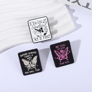 Set of 3 butterfly enamel pins with inspirational quotes on decorative white boards