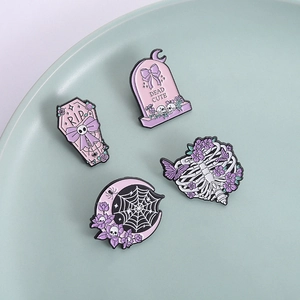 Set of four gothic Halloween enamel pins featuring moon coffin and tombstone motifs
