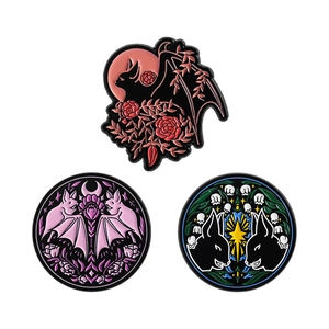 Gothic enamel pin set featuring dark bats and skulls with pink moon and rose details