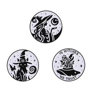 Three-piece black and white witch enamel pins featuring a cat, moon, and hat