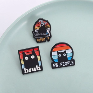 Set of three cute black cat enamel pins with colorful backgrounds and funny text quotes