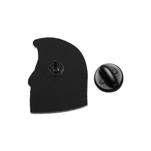 Detailed rear view of a metal enamel pin featuring a matte texture and black rubber clutch