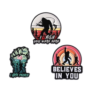 Set of 3 creative Bigfoot enamel pins with cartoon animal monster designs and funny quotes
