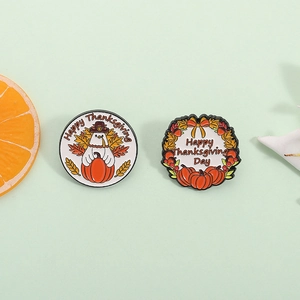 Thanksgiving enamel pins featuring cartoon turkey and pumpkin autumn wreath designs