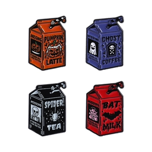 Set of four Halloween themed enamel pins shaped like drink cartons with spooky cartoons