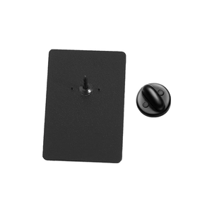Detail view of the matte black brooch back with a secure pin and rubber clutch