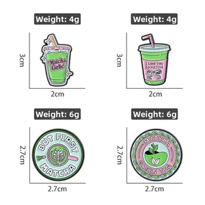 Set of four matcha green tea enamel pins featuring trendy drink patterns and creative slogans