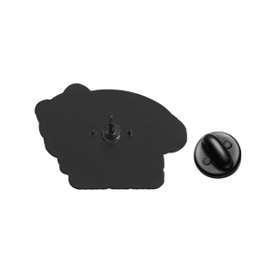 Detail of matte black enamel pin back with secure rubber butterfly clutch closure