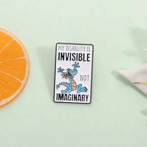 Blue dragon enamel pin with My Disability is Invisible Not Imaginary text on white base
