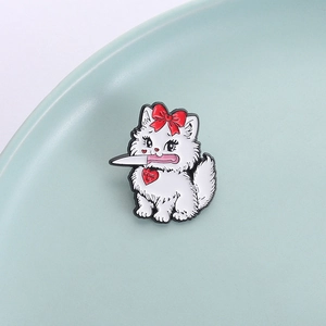 Quirky white cartoon cat enamel pin with a knife and a red heart love charm