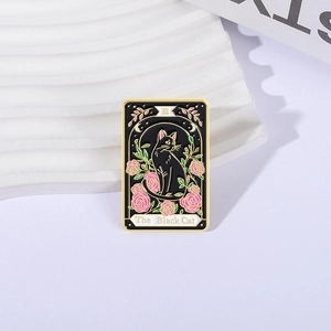 Dark tarot black cat enamel pin with pink roses and gold finish on wave pedestal