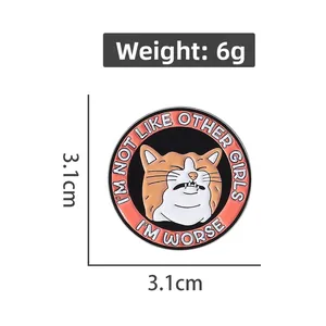 Detail of round enamel cat pin with witty quote, 3.1cm diameter and 6g weight specs