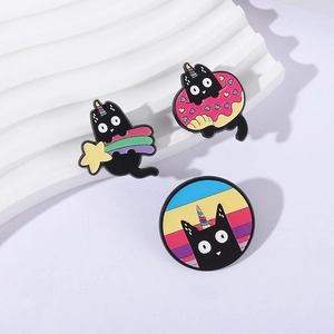 Three-piece black cat enamel pin set with rainbow, star and pink donut designs