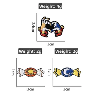 Detailed view of enamel pins showing size specifications for heart and candy designs