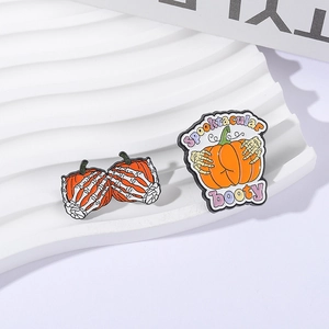 Halloween enamel pin set featuring pumpkin and skeleton hand with Spooktacular booty text