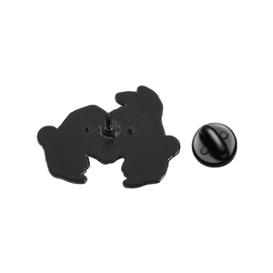 Detail view of colorful enamel brooch back with secure black rubber clasp and metal pin
