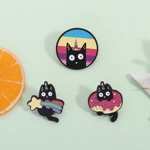 Three cute black cat enamel pins featuring unicorn, rainbow star, and pink donut designs