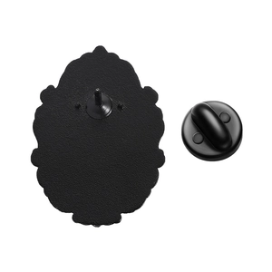 Detailed back view of the black enamel brooch featuring a secure rubber pin clutch