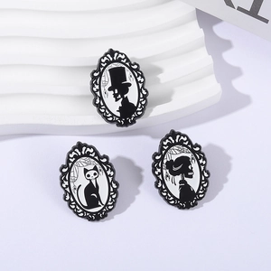 Set of 3 gothic pins featuring skull and black cat silhouette in baroque frames