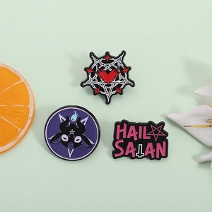 Enamel lapel pins featuring Baphomet goat head and Hail Satan pentagram designs