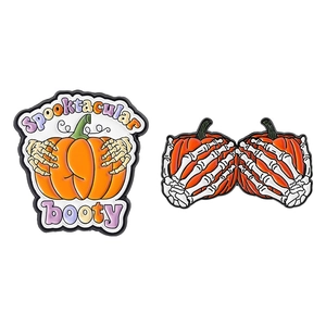 Halloween pumpkin enamel brooch set with skeletal hand and Spooktacular booty text design