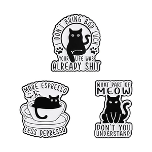 Three-piece black cat enamel pin set with humorous quotes on white background