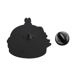 Detail of the black enamel pin back featuring textured metal and a rubber clutch attachment