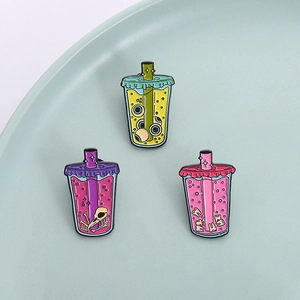 Three spooky bubble tea enamel pins featuring eyeballs, skeletons, and teeth motifs