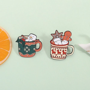 Set of two Christmas enamel brooches with snowman and gingerbread man in festive mugs