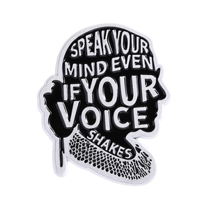 Enamel pin featuring a woman silhouette with Speak Your Mind even if your voice shakes text