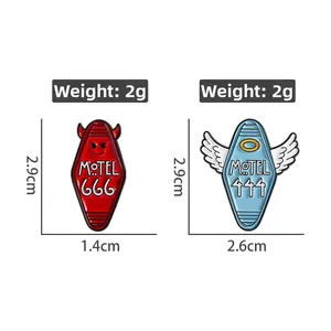 Detail view of retro motel key tag pins with devil and angel designs including dimensions