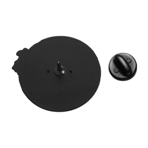 Detailed macro view of the matte black rubber clutch and metal pin back for badges