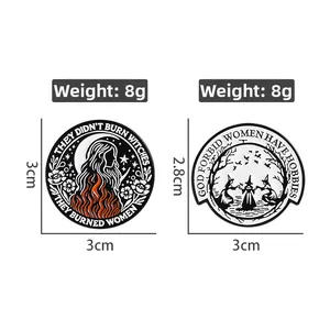 Detailed view of enamel pins showing feminist text and women dancing around flames