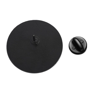 Detailed back view of a black round enamel pin showing metal needle and rubber clutch