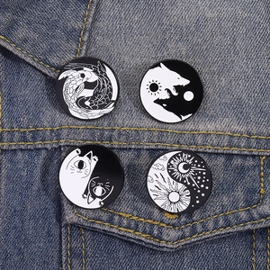 Creative black and white Yin Yang enamel pins set featuring koi fish, wolf, cat and moon