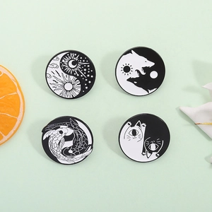 Set of four yin yang enamel pins with cat, wolf, koi, and celestial moon designs