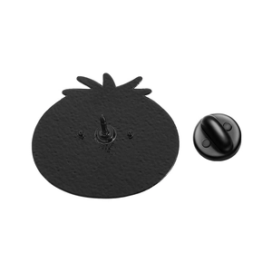 Close-up of the back of enamel cat badge with black rubber pin clutch and plating
