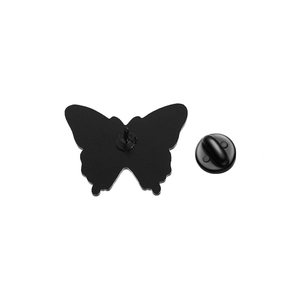 Detailed back view of a butterfly enamel pin with a black rubber clutch fastener