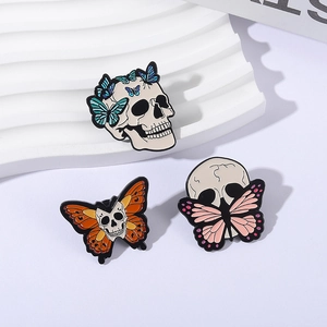 Creative punk Halloween skull and butterfly enamel pins set on decorative display