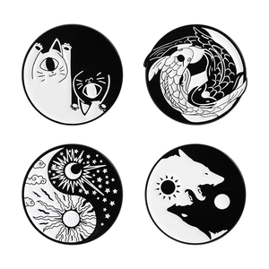 Set of four yin yang enamel pins featuring cats, koi fish, celestial sun moon, and wolf motifs